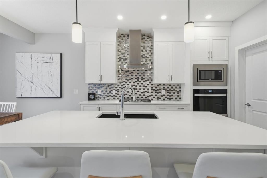902 Bluerock Way Sw, Calgary, AB - Indoor Photo Showing Kitchen With Upgraded Kitchen