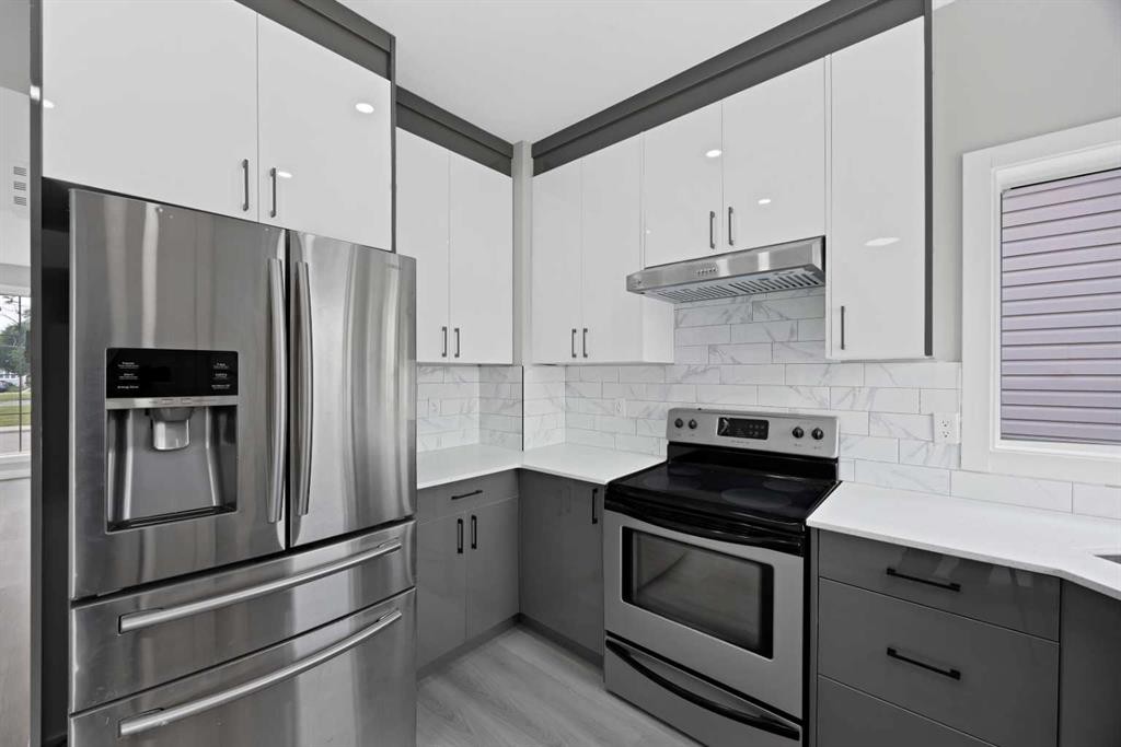 68 Laguna Close Ne, Calgary, AB - Indoor Photo Showing Kitchen With Stainless Steel Kitchen With Upgraded Kitchen