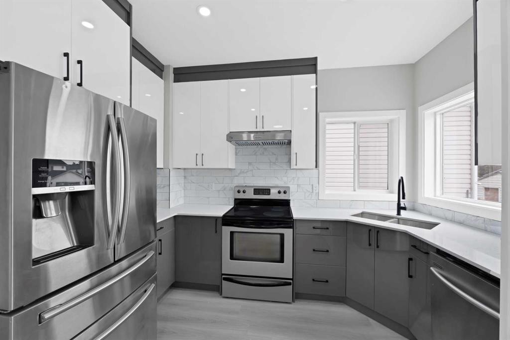 68 Laguna Close Ne, Calgary, AB - Indoor Photo Showing Kitchen With Stainless Steel Kitchen With Double Sink With Upgraded Kitchen