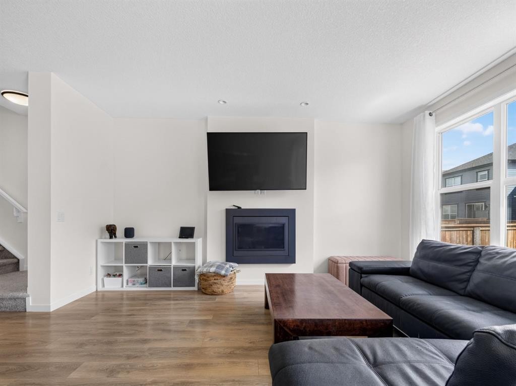 228 Masters Crescent Se, Calgary, AB - Indoor Photo Showing Living Room With Fireplace