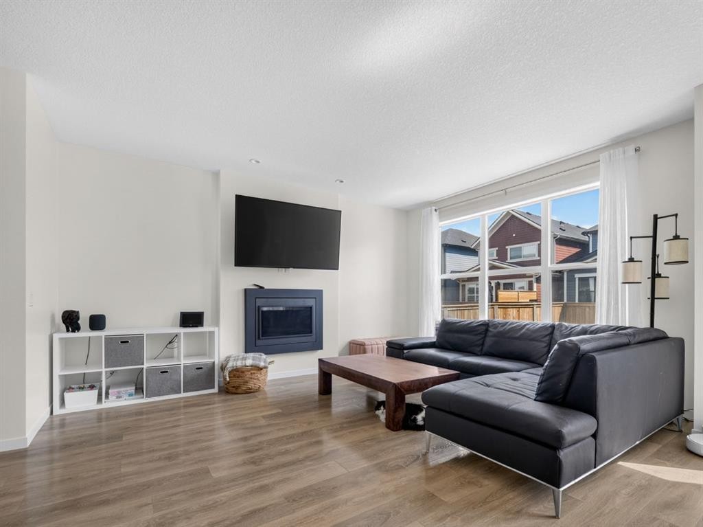 228 Masters Crescent Se, Calgary, AB - Indoor Photo Showing Living Room With Fireplace