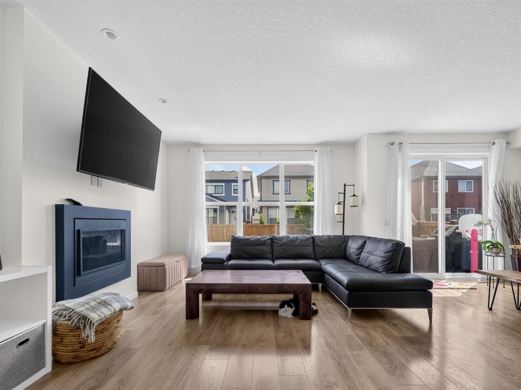 228 Masters Crescent Se, Calgary, AB - Indoor Photo Showing Living Room With Fireplace
