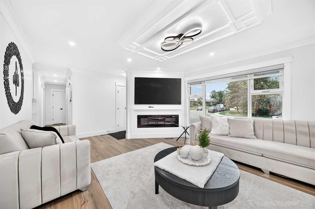 615 Marian Crescent Ne, Calgary, AB - Indoor Photo Showing Living Room With Fireplace