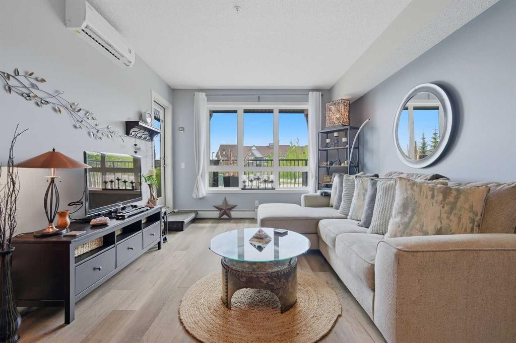 1106-175 Silverado Boulevard Sw, Calgary, AB - Indoor Photo Showing Living Room