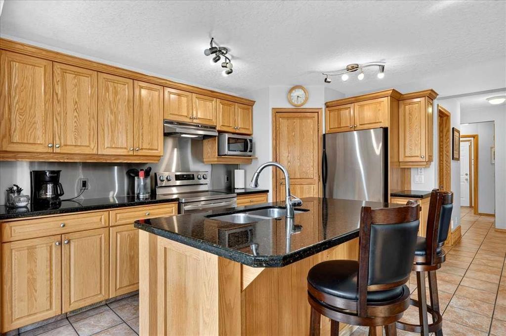 23 Cranfield Crescent Se, Calgary, AB - Indoor Photo Showing Kitchen With Double Sink