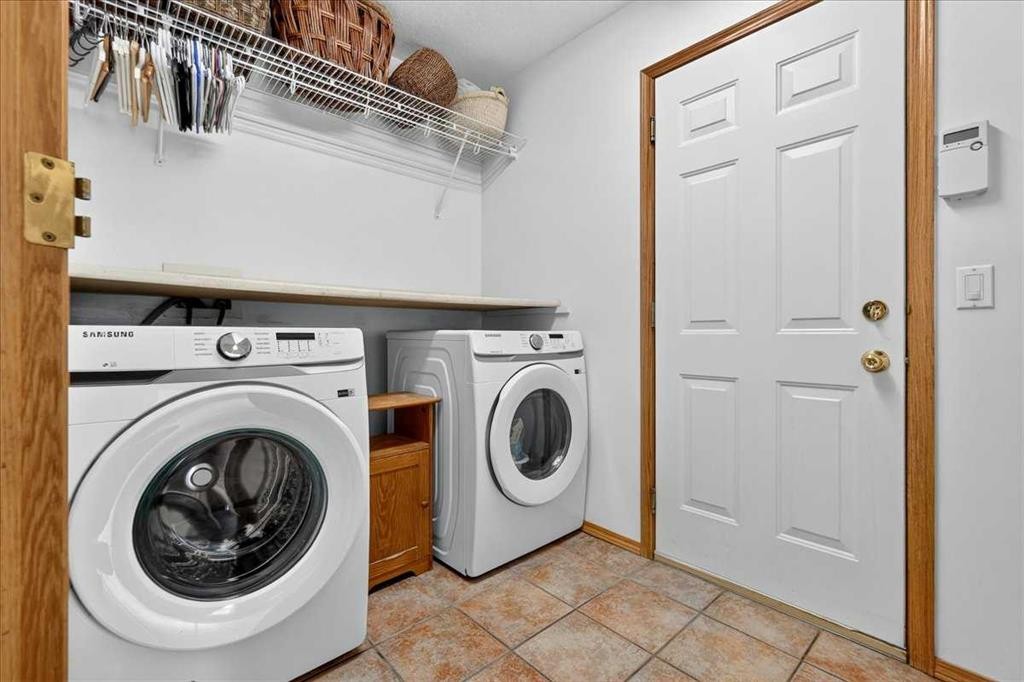23 Cranfield Crescent Se, Calgary, AB - Indoor Photo Showing Laundry Room