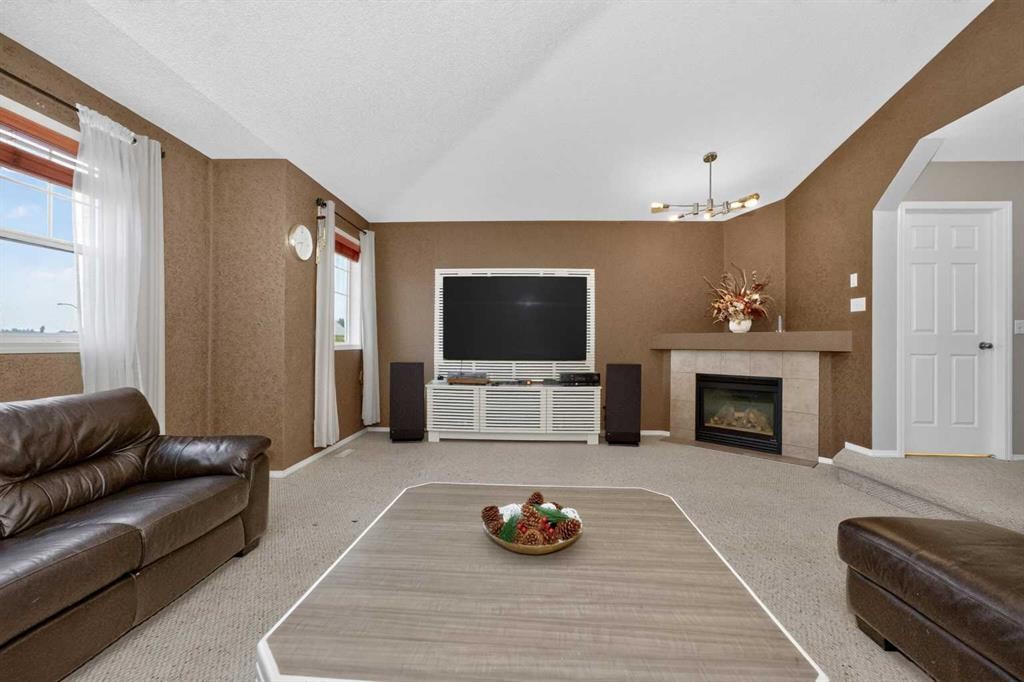 137 Douglas Glen Manor Se, Calgary, AB - Indoor Photo Showing Other Room With Fireplace
