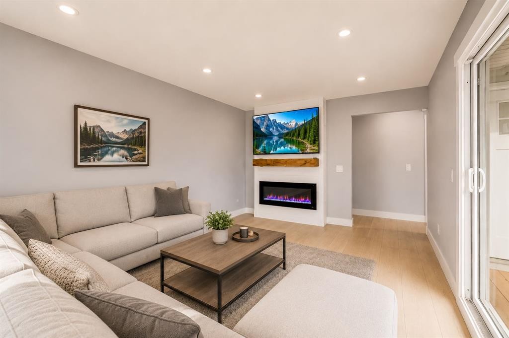 755 Penbrooke Road Se, Calgary, AB - Indoor Photo Showing Living Room With Fireplace