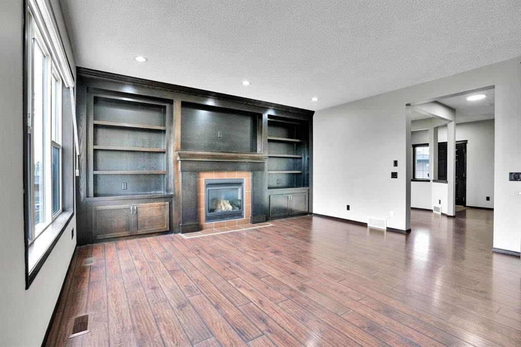 109 Pantego Terrace Nw, Calgary, AB - Indoor Photo Showing Other Room With Fireplace