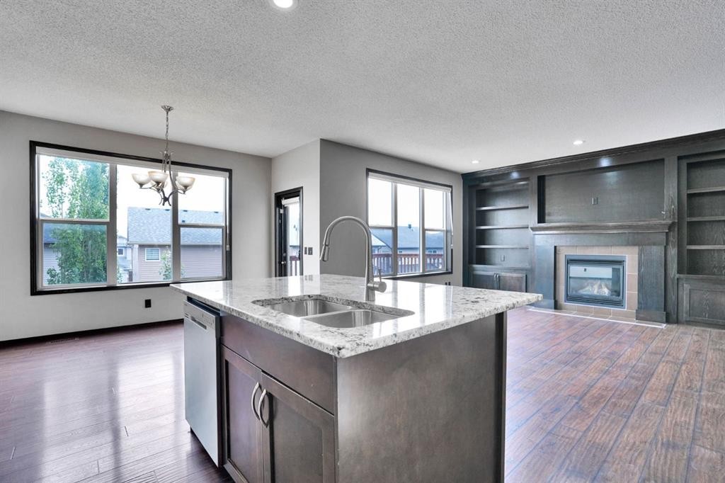 109 Pantego Terrace Nw, Calgary, AB - Indoor Photo Showing Kitchen With Fireplace With Double Sink