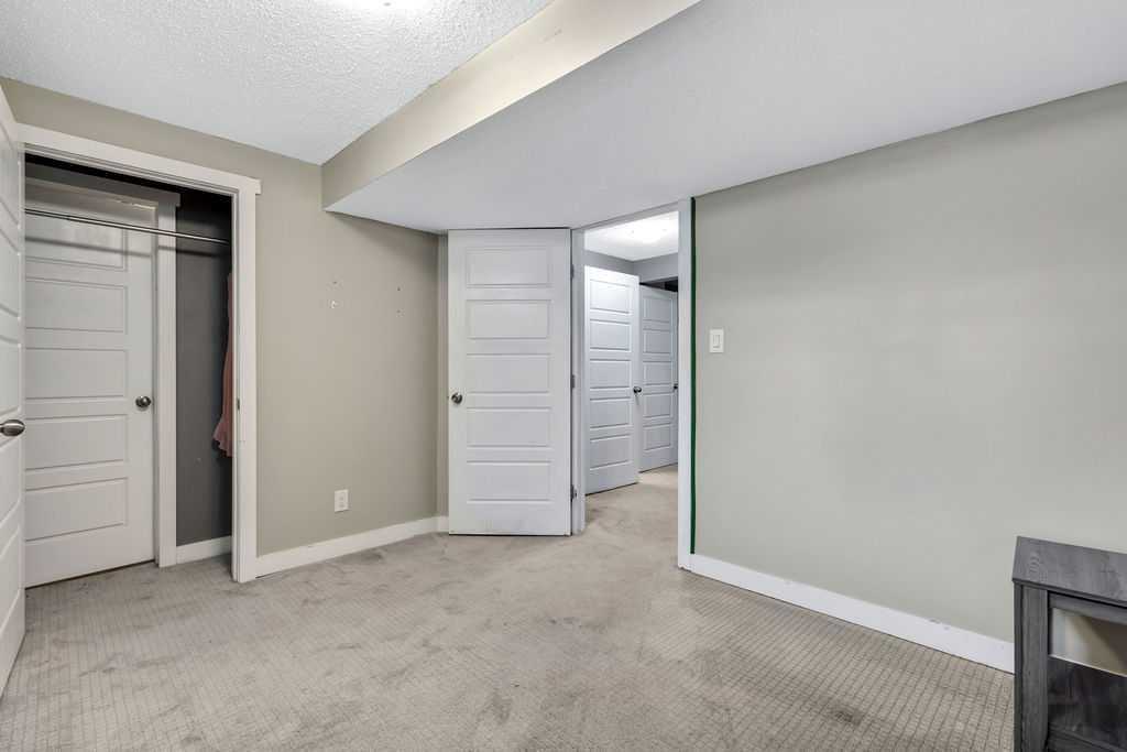 44 Falwood Crescent Ne, Calgary, AB - Indoor Photo Showing Other Room