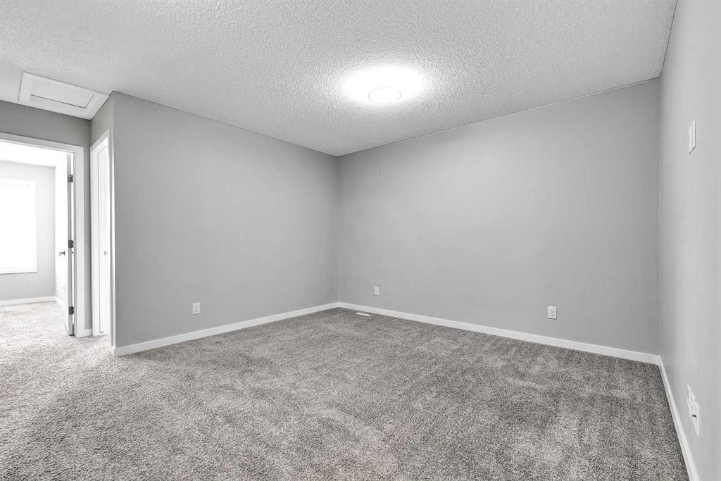 75 Evanscrest Way Nw, Calgary, AB - Indoor Photo Showing Other Room