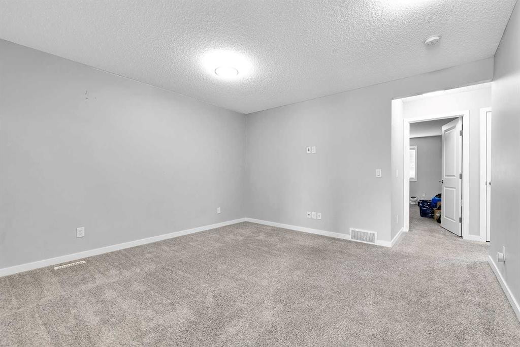 75 Evanscrest Way Nw, Calgary, AB - Indoor Photo Showing Other Room