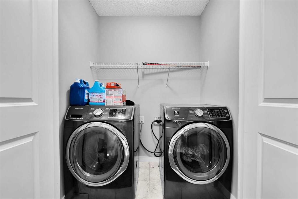 75 Evanscrest Way Nw, Calgary, AB - Indoor Photo Showing Laundry Room