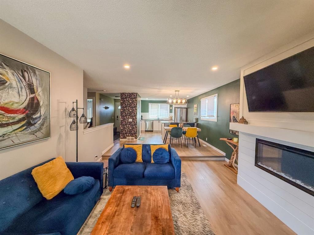 119 Fallswater Crescent Ne, Calgary, AB - Indoor Photo Showing Living Room With Fireplace