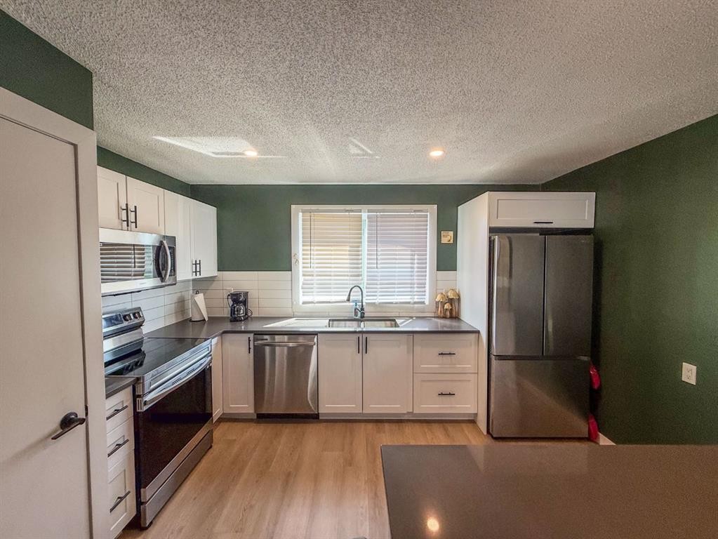 119 Fallswater Crescent Ne, Calgary, AB - Indoor Photo Showing Kitchen With Stainless Steel Kitchen