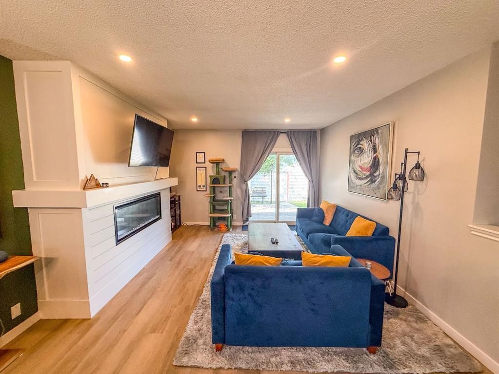 119 Fallswater Crescent Ne, Calgary, AB - Indoor Photo Showing Living Room With Fireplace