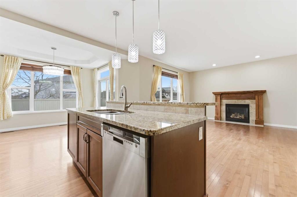 29 Royal Birkdale Drive Nw, Calgary, AB - Indoor Photo Showing Kitchen With Fireplace With Upgraded Kitchen