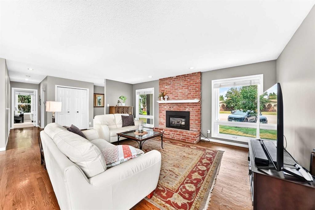 256 Midvalley Place Se, Calgary, AB - Indoor Photo Showing Living Room With Fireplace