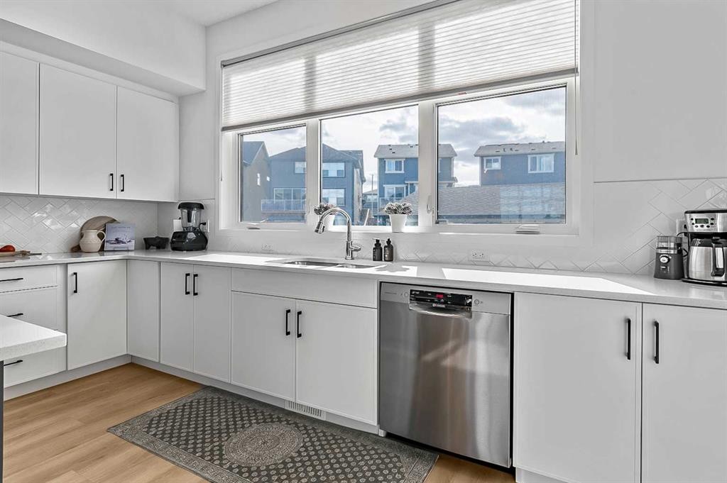 99 Masters Road Se, Calgary, AB - Indoor Photo Showing Kitchen With Double Sink