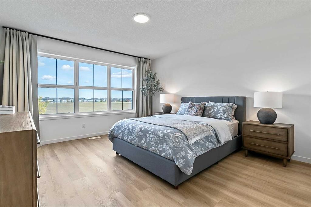 99 Masters Road Se, Calgary, AB - Indoor Photo Showing Bedroom