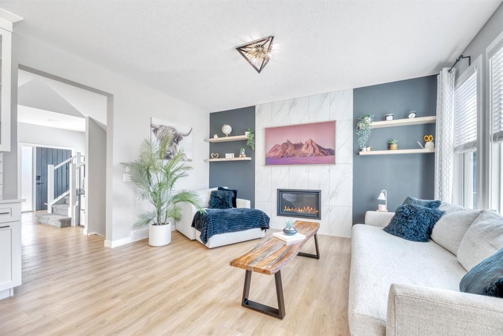 303 Dawson Harbour Court, Chestermere, AB - Indoor Photo Showing Living Room With Fireplace