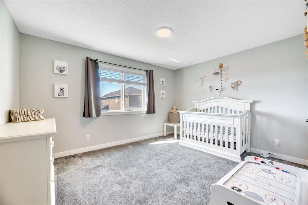 303 Dawson Harbour Court, Chestermere, AB - Indoor Photo Showing Bedroom