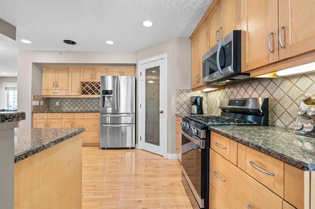 92 Cranston Drive Se, Calgary, AB - Indoor Photo Showing Kitchen With Upgraded Kitchen