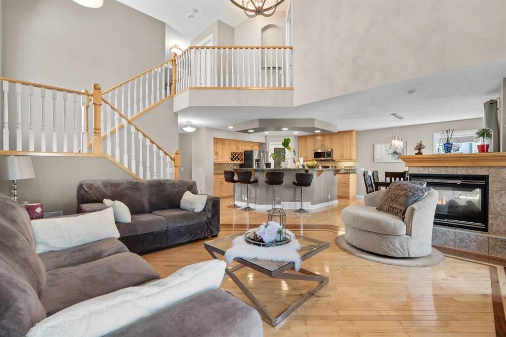 92 Cranston Drive Se, Calgary, AB - Indoor Photo Showing Living Room With Fireplace
