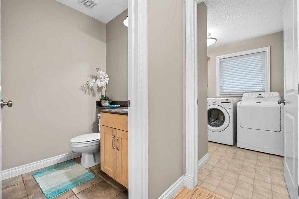 92 Cranston Drive Se, Calgary, AB - Indoor Photo Showing Laundry Room