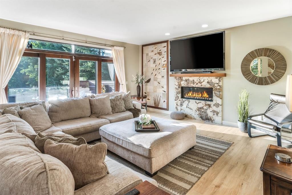 27 Snowberry Gate, Rural Rocky View County, AB - Indoor Photo Showing Living Room With Fireplace