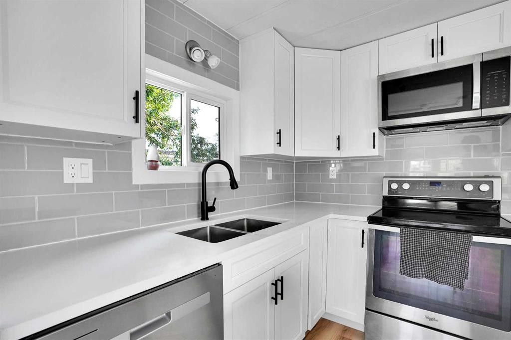 64 Huntwell Way Ne, Calgary, AB - Indoor Photo Showing Kitchen With Double Sink With Upgraded Kitchen