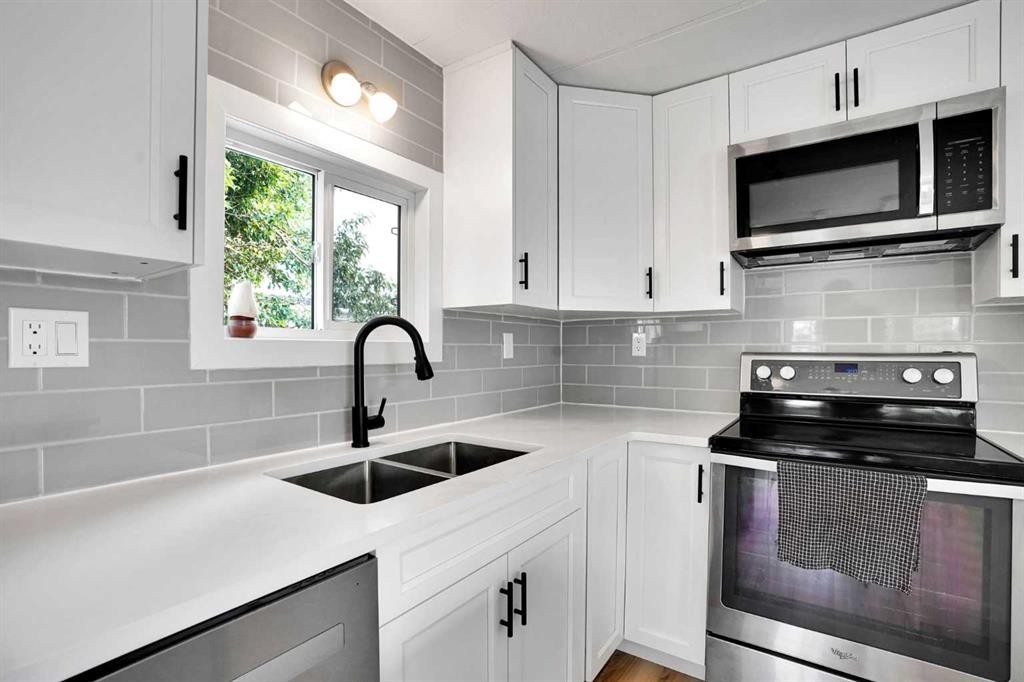 64 Huntwell Way Ne, Calgary, AB - Indoor Photo Showing Kitchen With Double Sink With Upgraded Kitchen