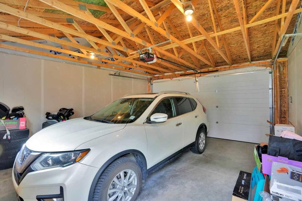 76 Amblefield Terrace Nw, Calgary, AB - Indoor Photo Showing Garage