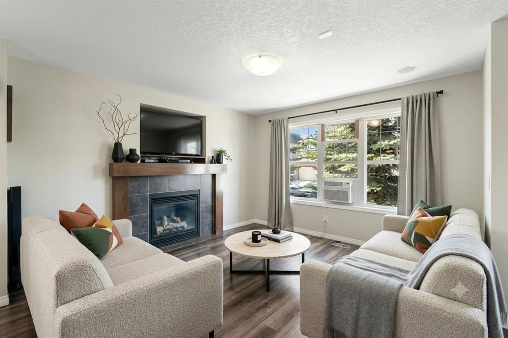 70 Walden Manor Se, Calgary, AB - Indoor Photo Showing Living Room With Fireplace