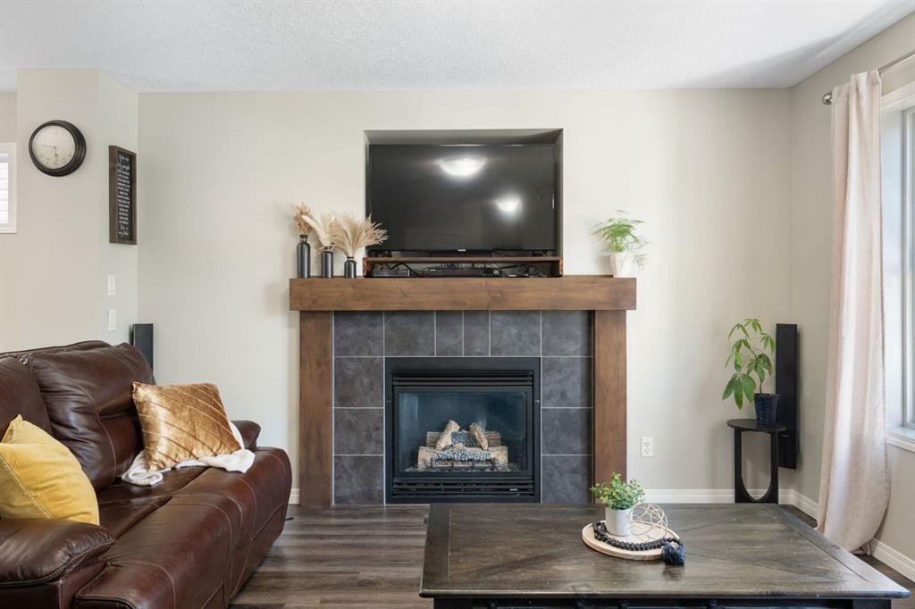 70 Walden Manor Se, Calgary, AB - Indoor Photo Showing Living Room With Fireplace