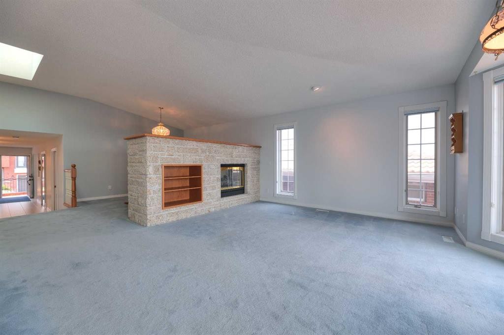 8 Prominence Path Sw, Calgary, AB - Indoor With Fireplace