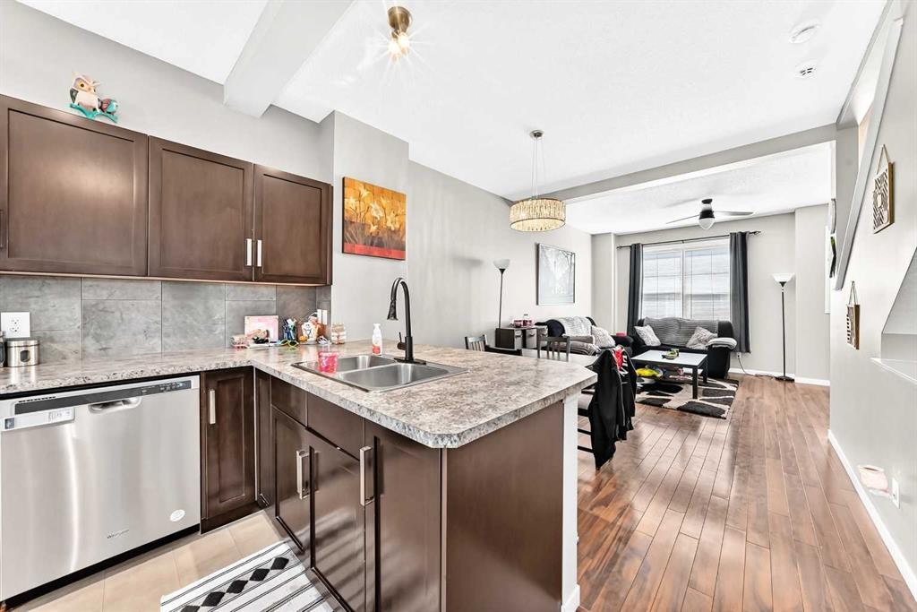 60 New Brighton Point Se, Calgary, AB - Indoor Photo Showing Kitchen With Double Sink With Upgraded Kitchen