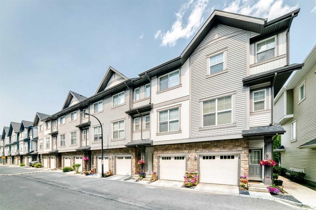 60 New Brighton Point Se, Calgary, AB - Outdoor With Facade