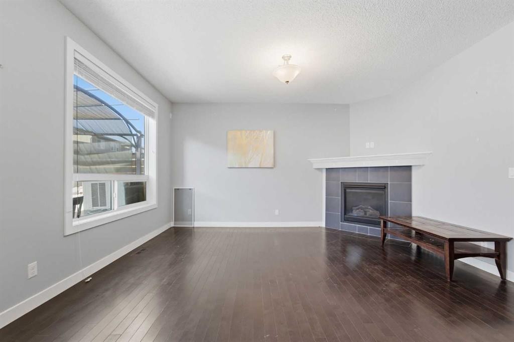 174 Morningside Circle Sw, Airdrie, AB - Indoor With Fireplace