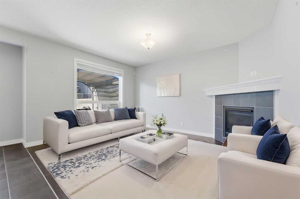 174 Morningside Circle Sw, Airdrie, AB - Indoor Photo Showing Living Room With Fireplace