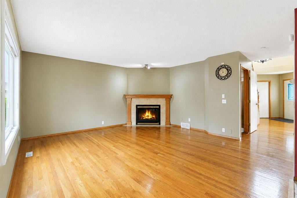332 Harvest Hills Drive Ne, Calgary, AB - Indoor Photo Showing Living Room With Fireplace