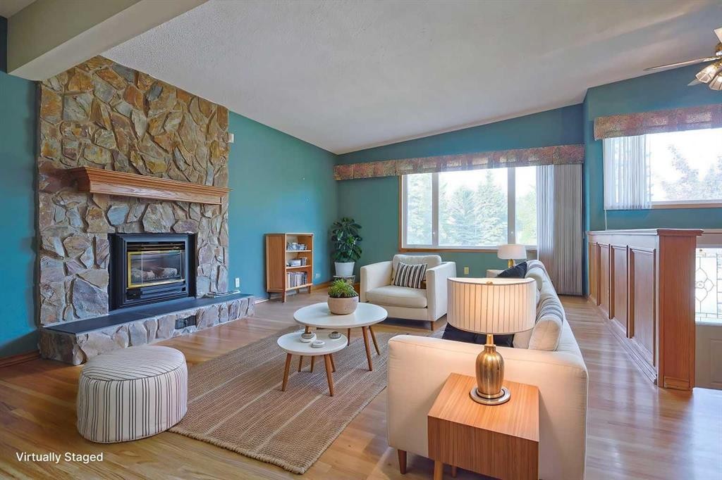 4904 Verulum Place Nw, Calgary, AB - Indoor Photo Showing Living Room With Fireplace