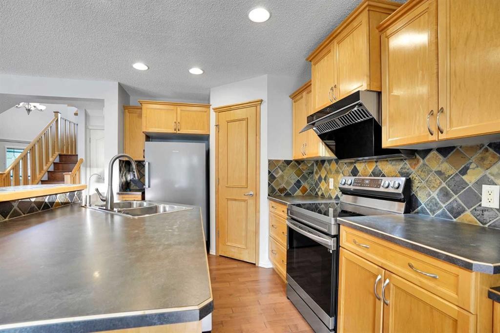 101 Royal Oak Crescent Nw, Calgary, AB - Indoor Photo Showing Kitchen With Stainless Steel Kitchen With Double Sink