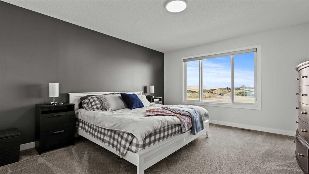 152 Threepoint Cove, Okotoks, AB - Indoor Photo Showing Bedroom