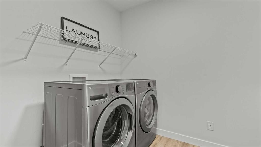 152 Threepoint Cove, Okotoks, AB - Indoor Photo Showing Laundry Room