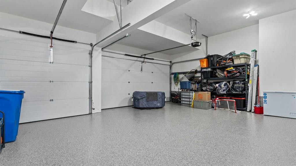 152 Threepoint Cove, Okotoks, AB - Indoor Photo Showing Garage