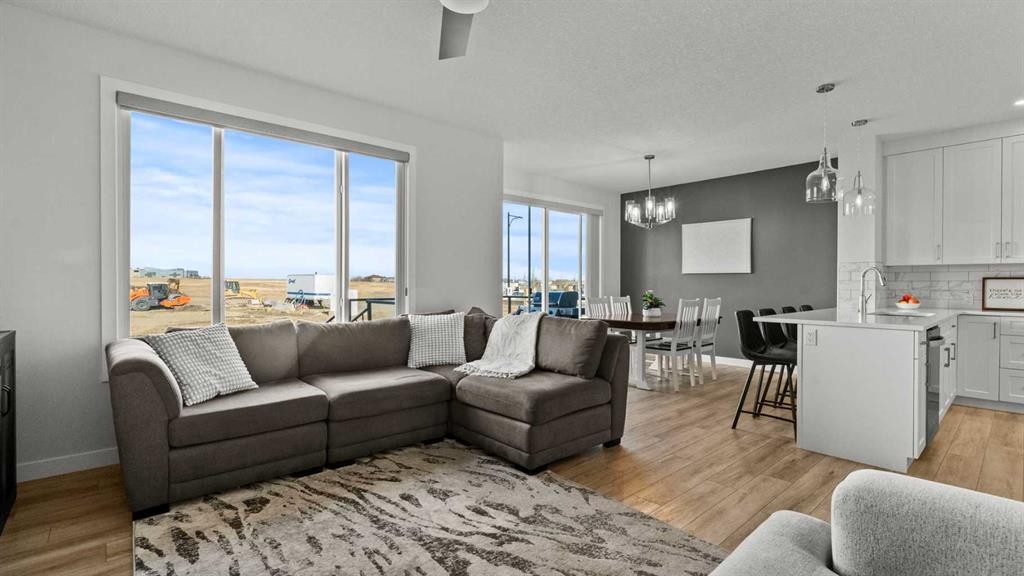 152 Threepoint Cove, Okotoks, AB - Indoor Photo Showing Living Room