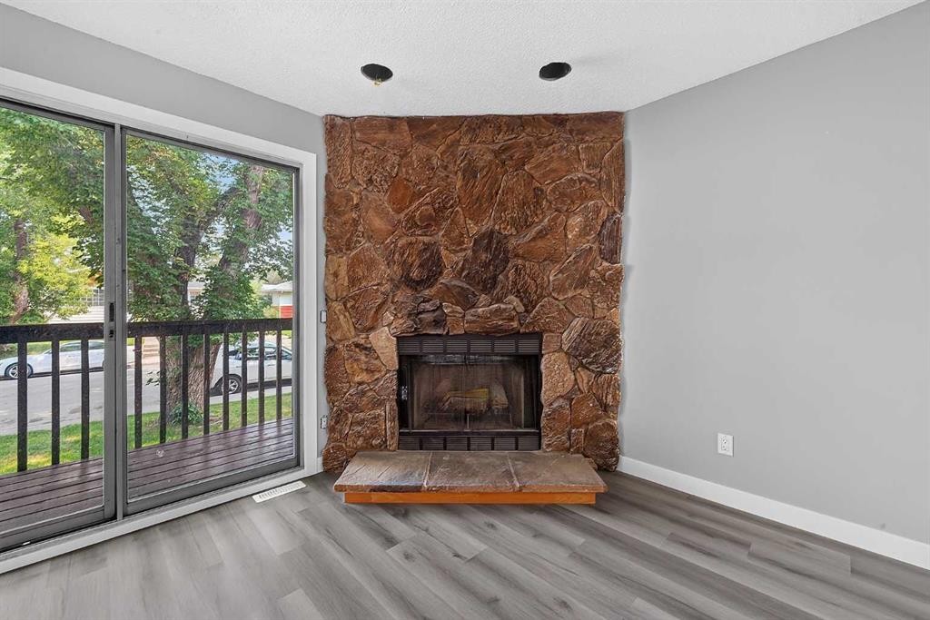723 55 Avenue Sw, Calgary, AB - Indoor Photo Showing Living Room With Fireplace