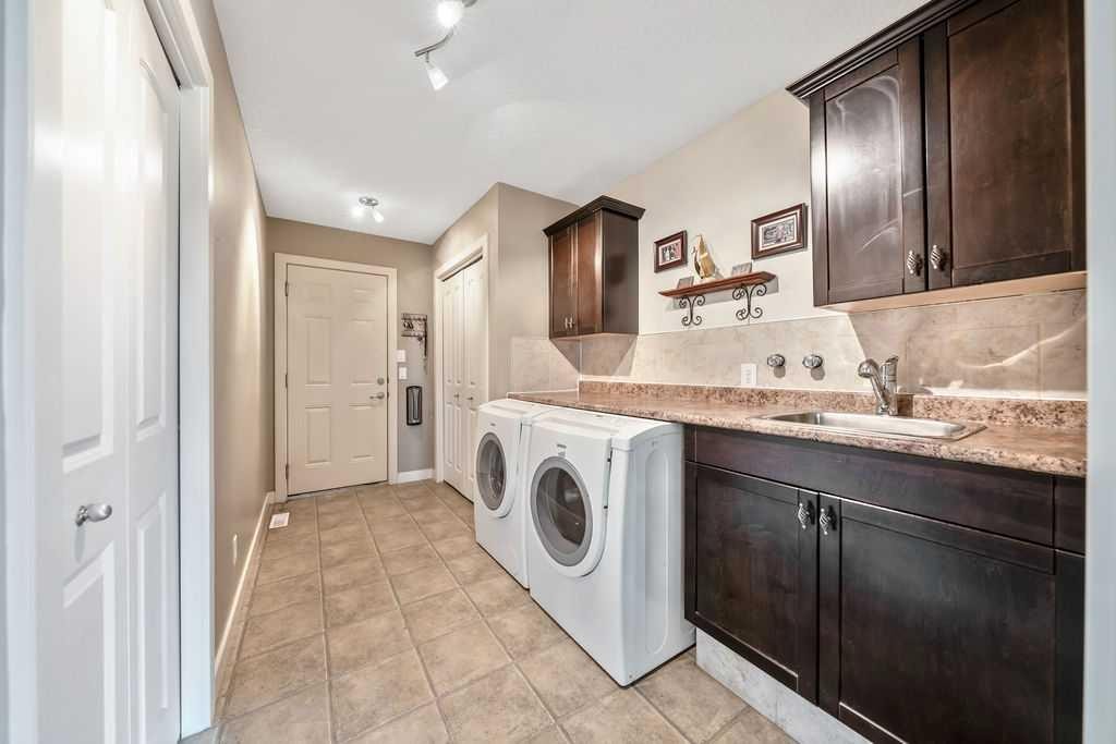 259 Willow Ridge Manor, Diamond Valley, AB - Indoor Photo Showing Laundry Room